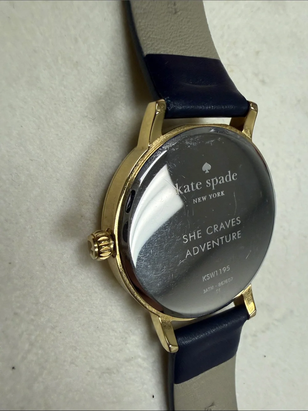 kate spade Gold-Tone Sagittarius Watch with Black Strap and Mother-of-Pearl Dial
